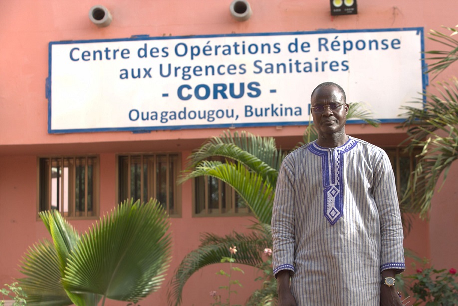 Dr. Yameogo in front of the Public Health Emergency Operations Center of Burkina Faso.  (Photo Credit: Human Interest Documentaries / Davycas International, 2021)